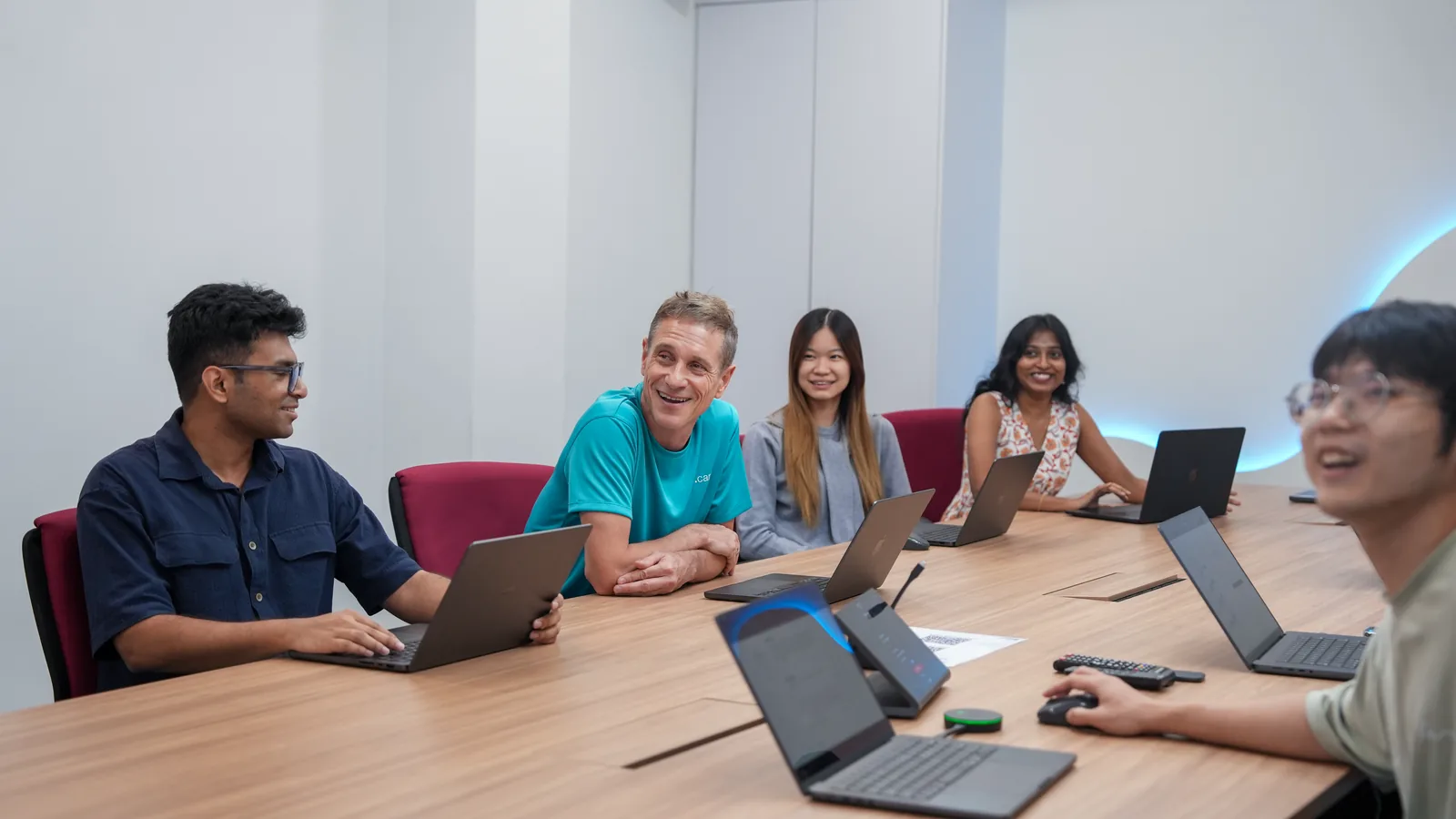Members of the n1 team working together around a table